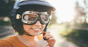 Woman Wearing Bike Helmet And Goggles