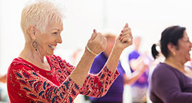 Senior woman taking dance class