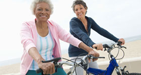 Two mature women on bikes