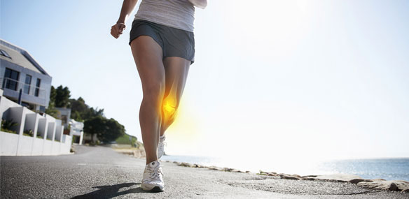 Woman running knee joint emphasis