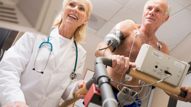 Elderly man having heart treadmill stress test