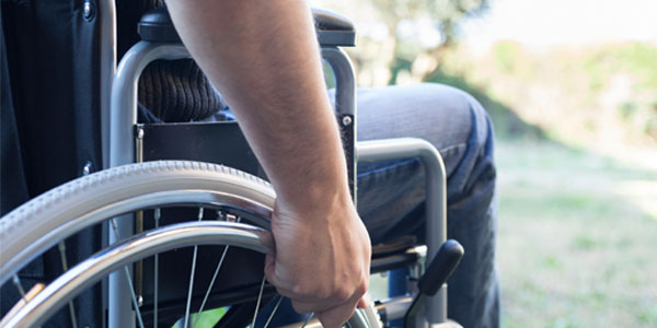 Close up of man using wheelchair