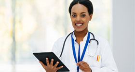 African-American doctor holding digital tablet