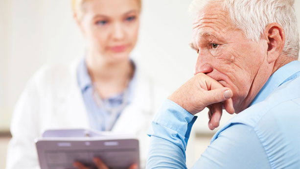 Elderly male with concerned look at doctor's office