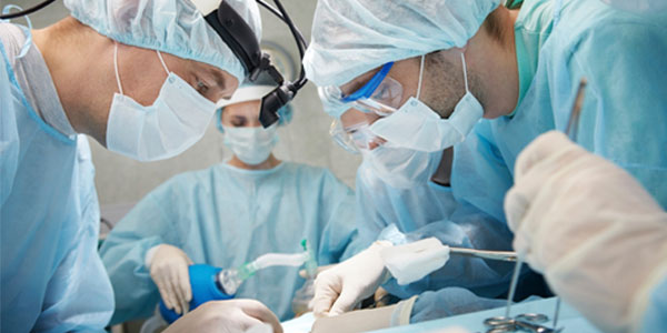 Surgeons performing operation at hospital