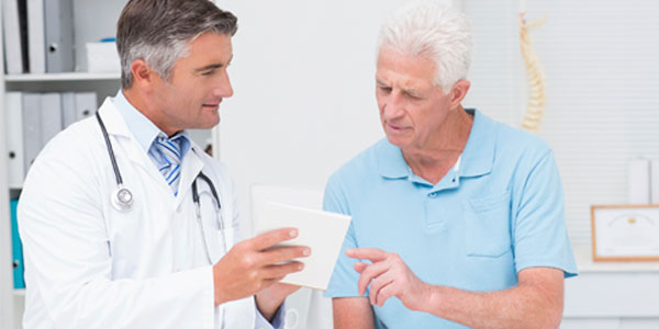 Male doctor and patient in discussion
