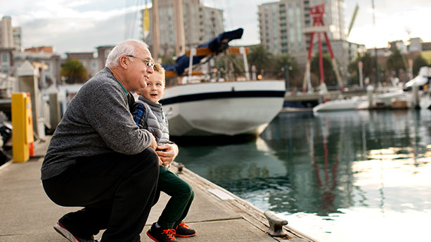 Boy and gandfather at marina