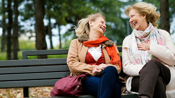 Two women laughing outside