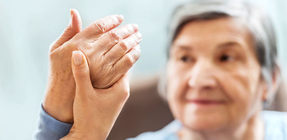 Senior woman having hand therapy