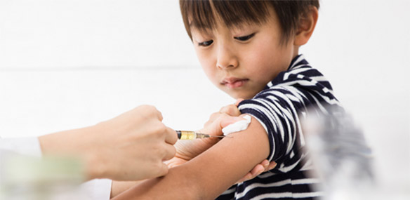 Asian boy getting immunization