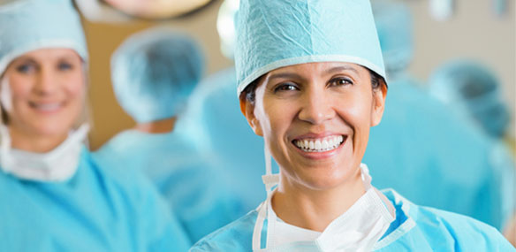 Female Hispanic surgeon in operating room