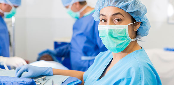 Hispanic female surgeon preparing for surgery