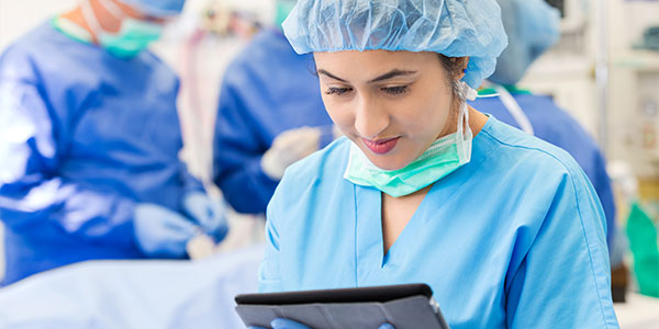 Surgical nurse with tablet