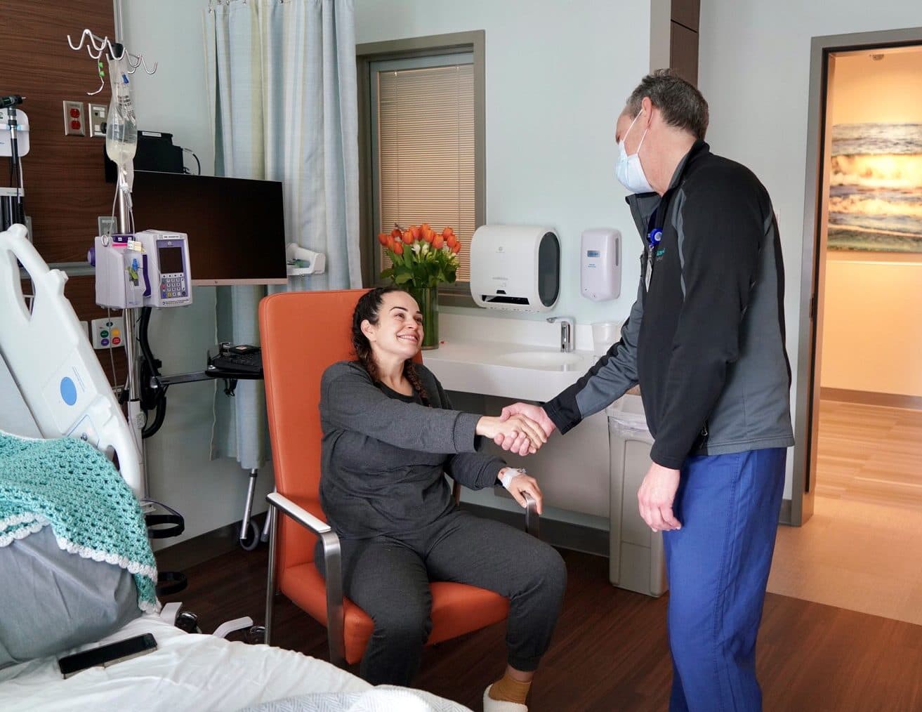 Danielle Rojas is greeted by Dr. Steven Katznelson, transplant nephrologist, following the donation of her healthy kidney to her sister-in-law Gabby Rojas.
