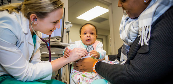 Sutter Health network doctor examining baby