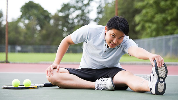 asian-male-stretching-playing-tennis