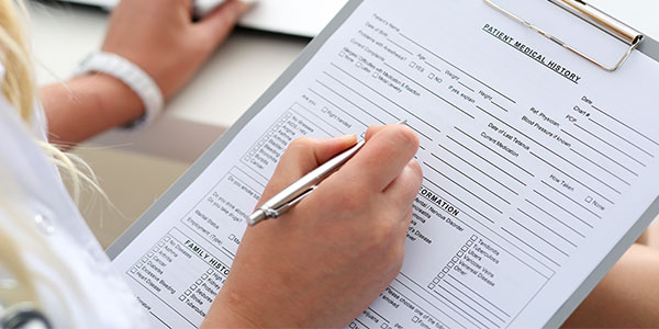 Patient filling out medical history form