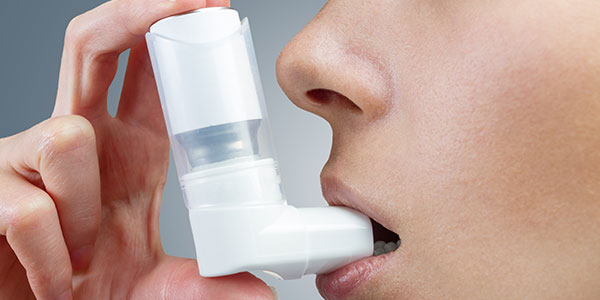 person using inhaler