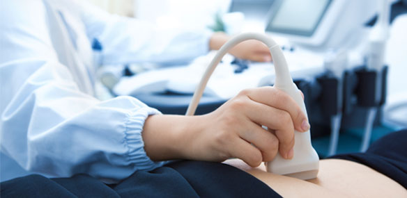 Close up of woman having abdominal ultrasound exam