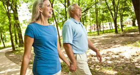 Middle-aged couple walking in the park