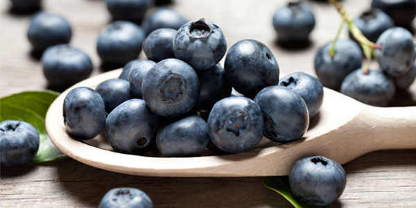 Blueberries on wooden spoon