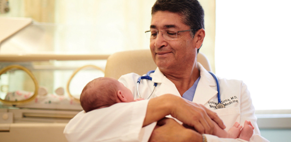 Dr. Sosa holding baby