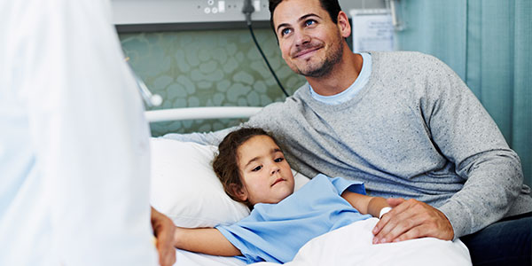 Father with daughter in hospital