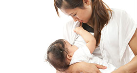 Asian mother breastfeeding baby
