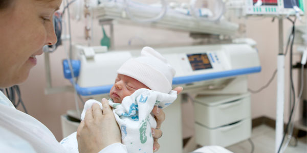 Mother with premature infant in NICU