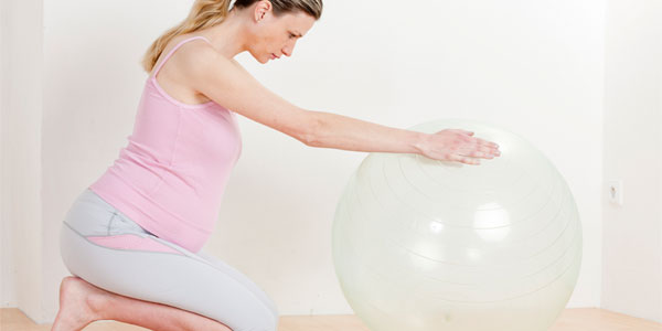 Pregnant woman with birthing ball