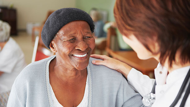 Mature African American woman with nurse