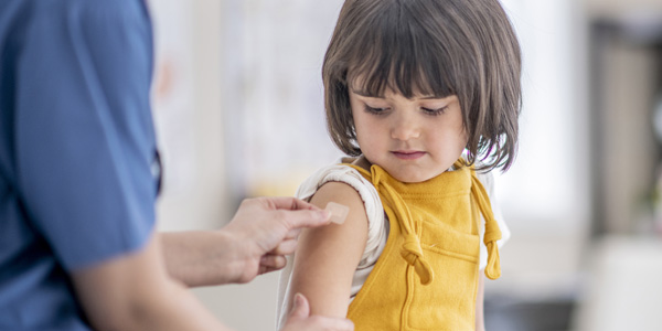 Young girl receiving vaccine