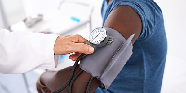 African-American man having blood pressure checked