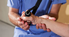 Doctor working on patient wrist