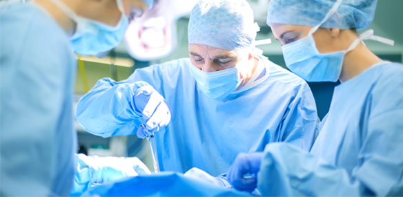 Group of surgeons operating