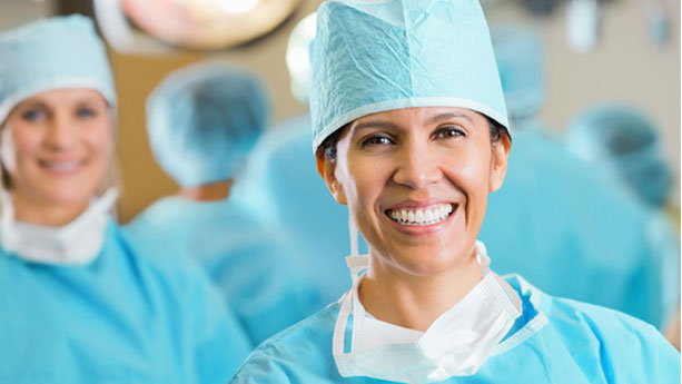 Female Hispanic surgeon in operating room