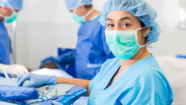 Hispanic female surgeon preparing for surgery