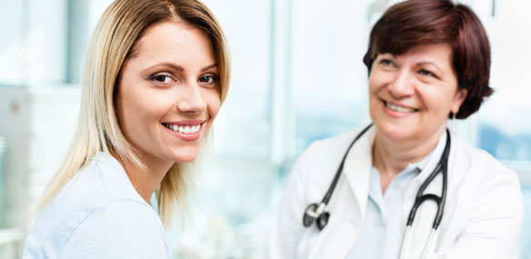 Middle-aged female doctor and patient at doctor's office