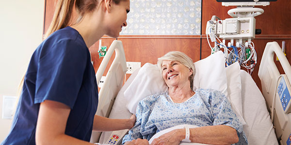 Woman in hospital with nurse