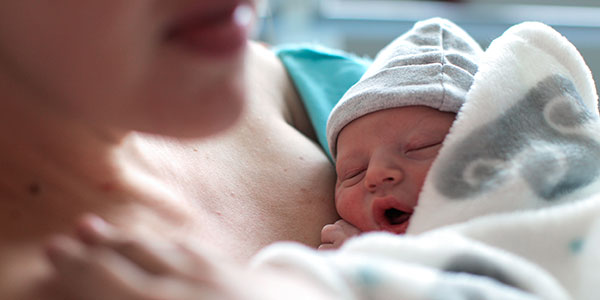 Newborn baby on mom's chest