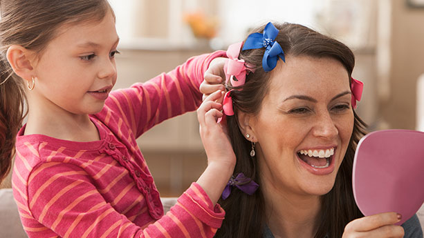 Mother and daughter styling hair