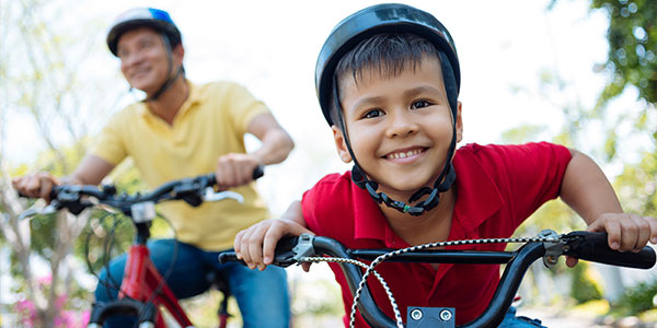 Boy wearing helmet on bicycle