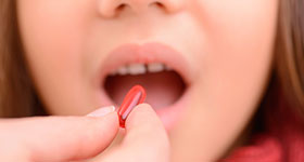 Child taking pill