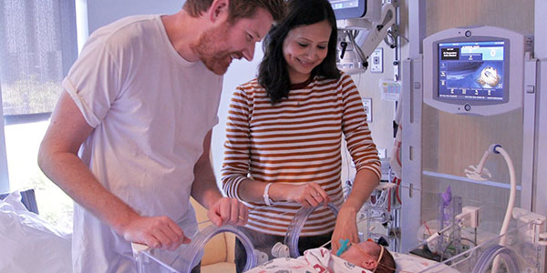 Parents and infant in the NICU