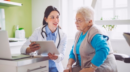Doctor speaking with Elderly Woman